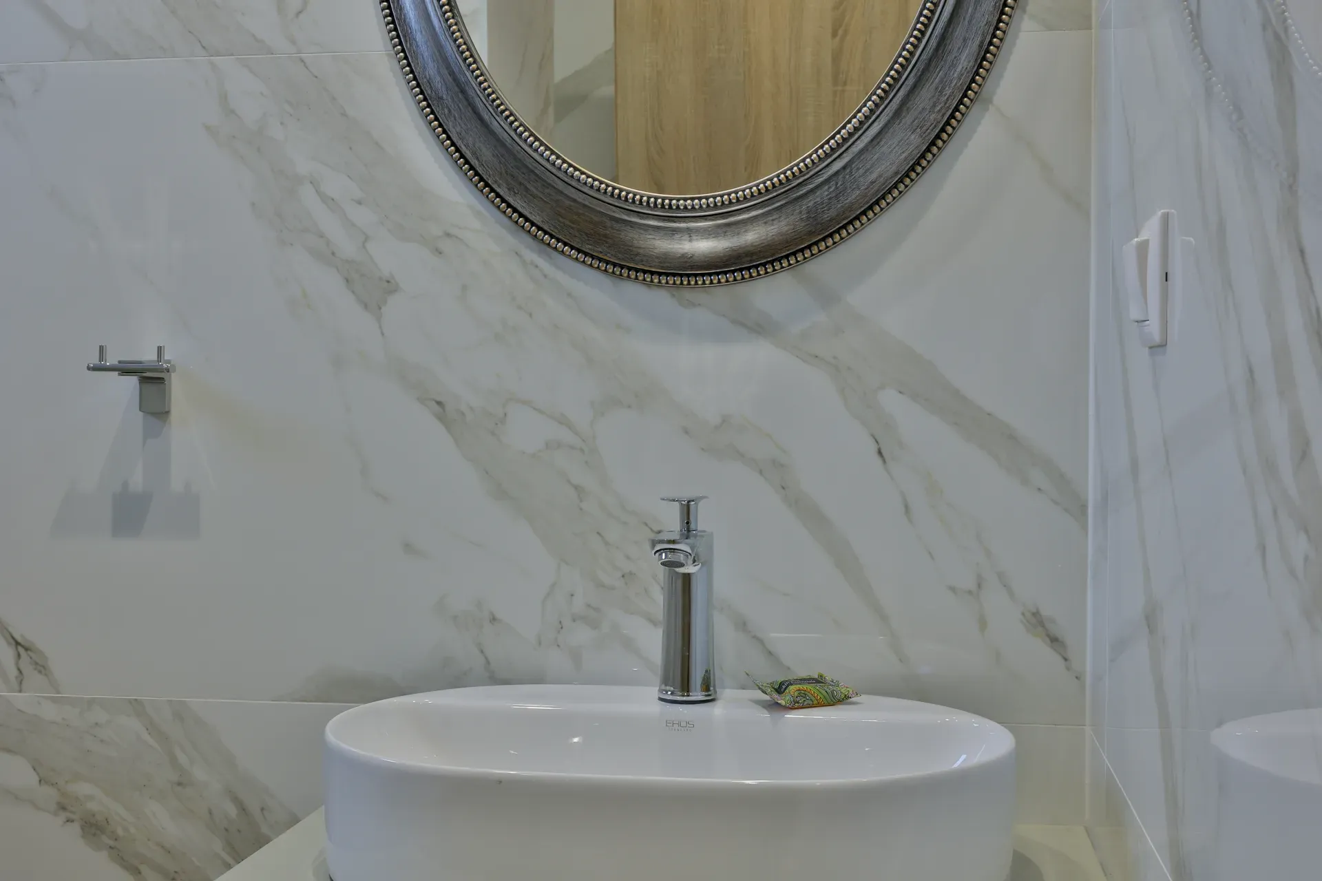 Bathroom with marble walls and washbasin