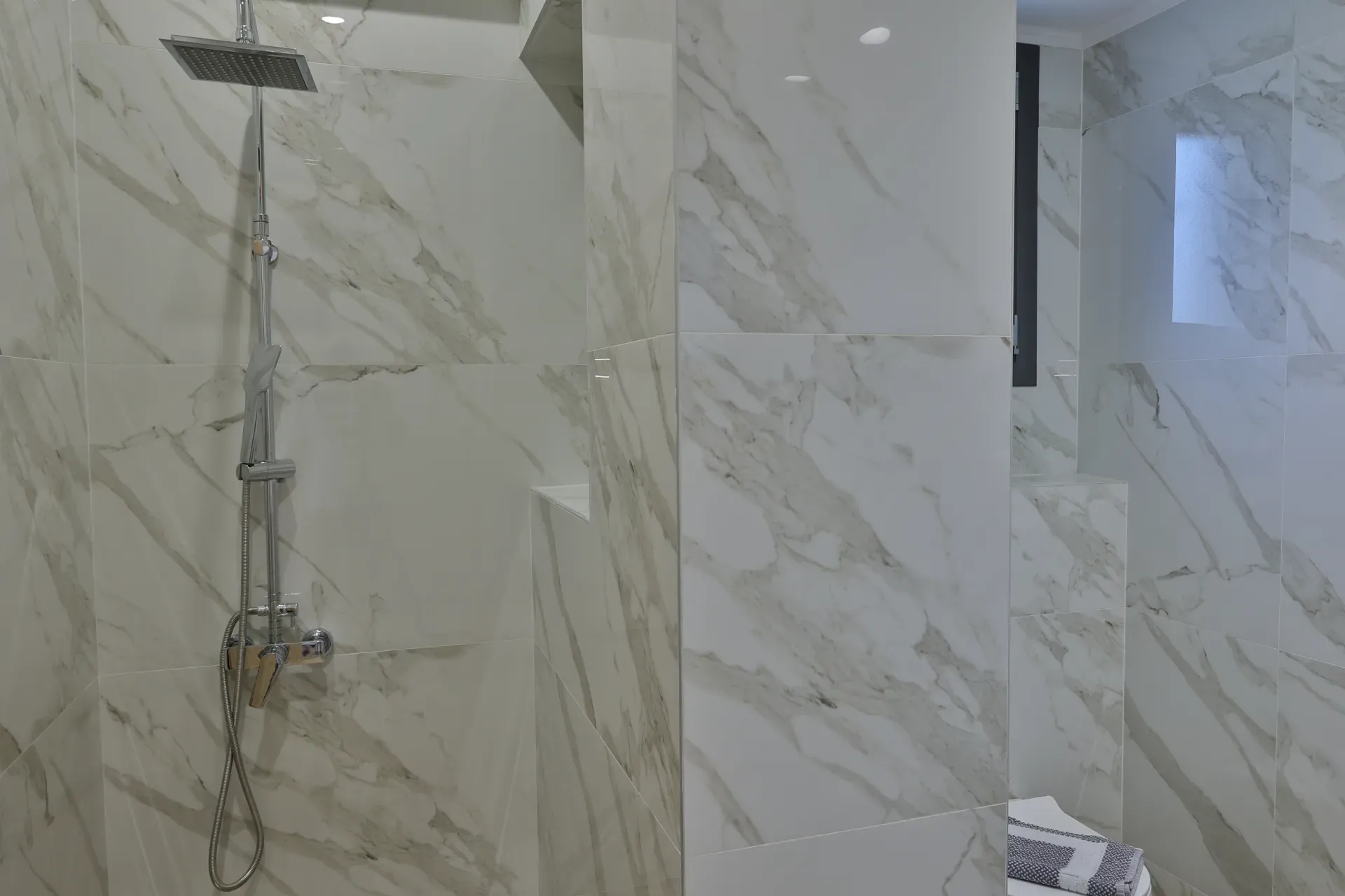Shower with marble walls